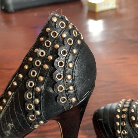 Very high black heels with gold detail. - Picture 4 of 4